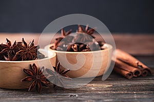 Star anise in bowl and cinnamon stick