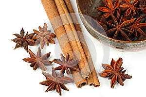 Star anise,cinnamon stick and a bowl