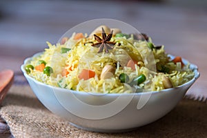 Star anise on flavoured rice with vegetable photo