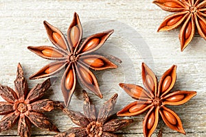 Star anise fruits on the wooden board, top view