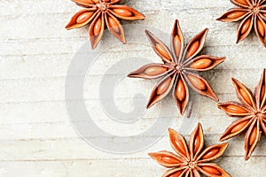 Star anise fruits on the wooden board, top view