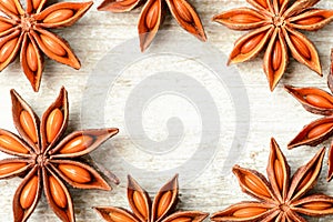 Star anise fruits on the wooden board, top view