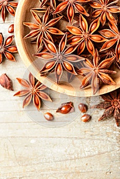 Star anise fruits on the wooden board, top view