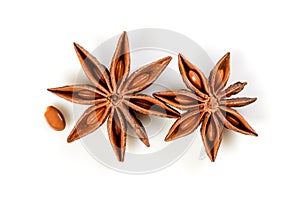 Star anise. Two star anise fruits with seed. Macro close up Isolated on white background with shadow, top view of chinese badiane