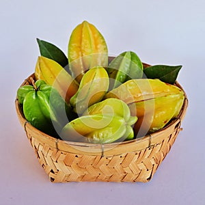 Star apples. Tropical fruits in bamboo basketwork