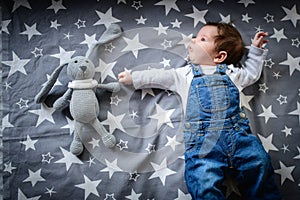Star baby. The child lies with the stars. baby`s night dreams
