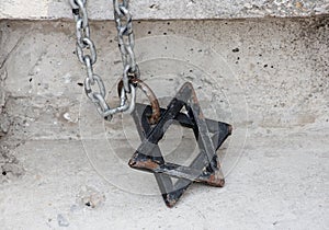 Star of David Magen David on the chain. Element of the decor of the synagogue. Symbol of Judaism, the symbol of the Jews photo