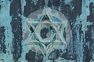 Star of david, patina, verdigris, on metal surface photo