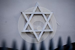 Star of David, symbol of Judaism on wall.