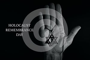 Star of david and text holocaust remembrance day