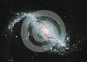 Star forming region, spiral galaxy NGC 1672, young blue stars. Elements of this image furnished by NASA. Retouched image