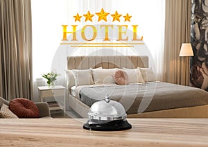 5 Star hotel. Reception desk with service bell and view of bedroom on background