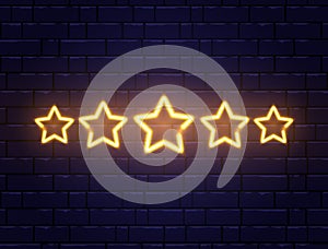 Star rating neon banner. Golden five stars on brick wall. Shining signboard. Night bright advertising. Vector