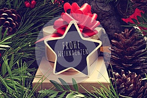 Star-shaped chalkboard with the text Frohe Weihnachten, Merry Ch