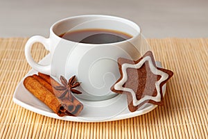 Star shaped chocolate chip cookies with anise and cinnamon with a cup of tea