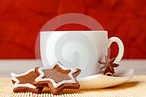 Star shaped chocolate chip cookies with anise with a cup of tea