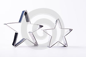 A star shaped cookie cutter on white background