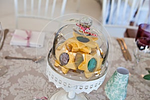 Star shaped jam cookies and biscuits in a glass sweet bowl