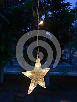 Star shaped light closeup of curtain string for festival