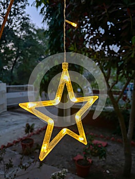 Star shaped light closeup of curtain string for festival