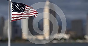 The Star spangled banner with out of focus city background