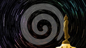 Star trail on sky back Buddha looking seven day style standing status