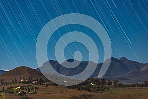 Star trails above the mountains in the town of Clarens, South Africa