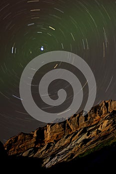 Star Trails around Polaris above a Sandstone Cliff photo