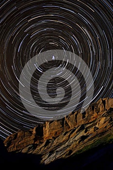 Star Trails around Polaris above a Sandstone Cliff photo