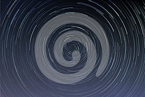 Star trails in a night sky  long exposure style realistic circular star arcs pattern