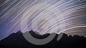 Star trails over Doi Luang Chiang Dao mountain at night