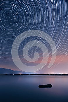 Star trails over the lake