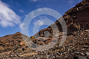 Star trails with Polaris in the middle. Rocky landscape during the night. Night landscape. Tasartico, Gran Canaria, Canary Islands