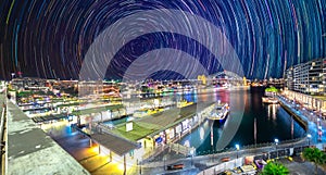 Star trails in the sky over Sydney Harbour NSW Australia startrails. lovely patterns and beautiful colours of the night.