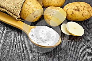 Starch potato in spoon on board