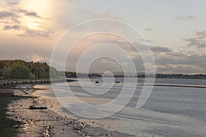 Starcross evening, Exmouth, devon: low tide, sunrise. Cloudscape horizon