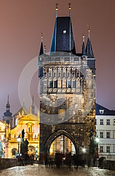 Stare Mesto Tower from the Charles Bridge at night, Prague. photo