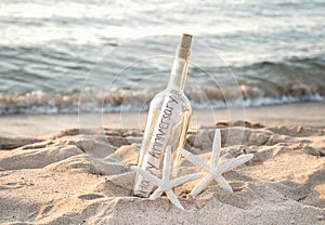 Starfish with anniversary message in bottle