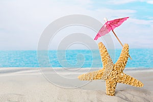 Starfish on beach with parasol