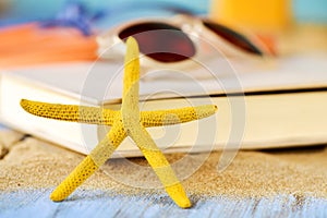Starfish, book and sunglasses