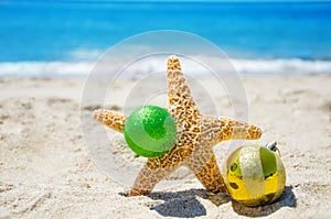 Starfish with Christmas ball - holiday concept