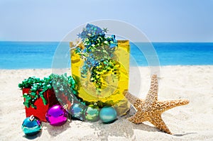 Starfish with Christmas balls and gifts - holiday concept