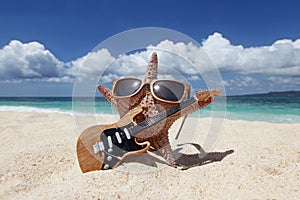 Starfish guitar player on beach