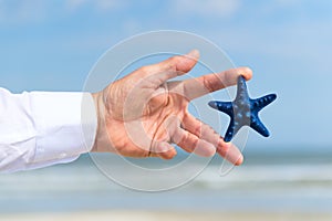 Starfish in hand business man