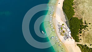 Starfish Island, Puerto Princesa, Palawan.Lots of boats on the beach, tourist route. Island hopping Tour at Honda Bay