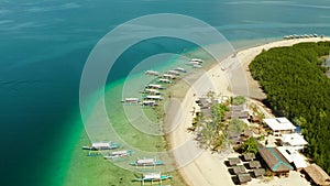 Starfish Island, Puerto Princesa, Palawan.Lots of boats on the beach, tourist route. Island hopping Tour at Honda Bay