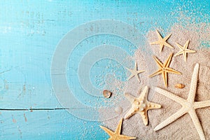 Starfish and seashell on sand for summer holidays and travel background. photo