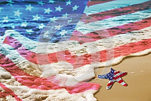 Starfish with USA flag on the sandy beach for Labor day concept