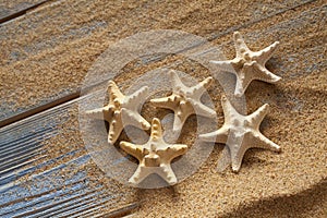 Starfishes on sand and planks