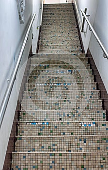 Staricase with mosaic stair treads